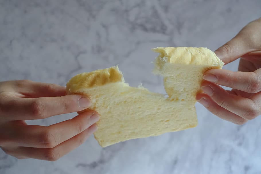 Person Holding Slice of Loaf Bread, baked, hand, nutrition, pastry HD wallpaper