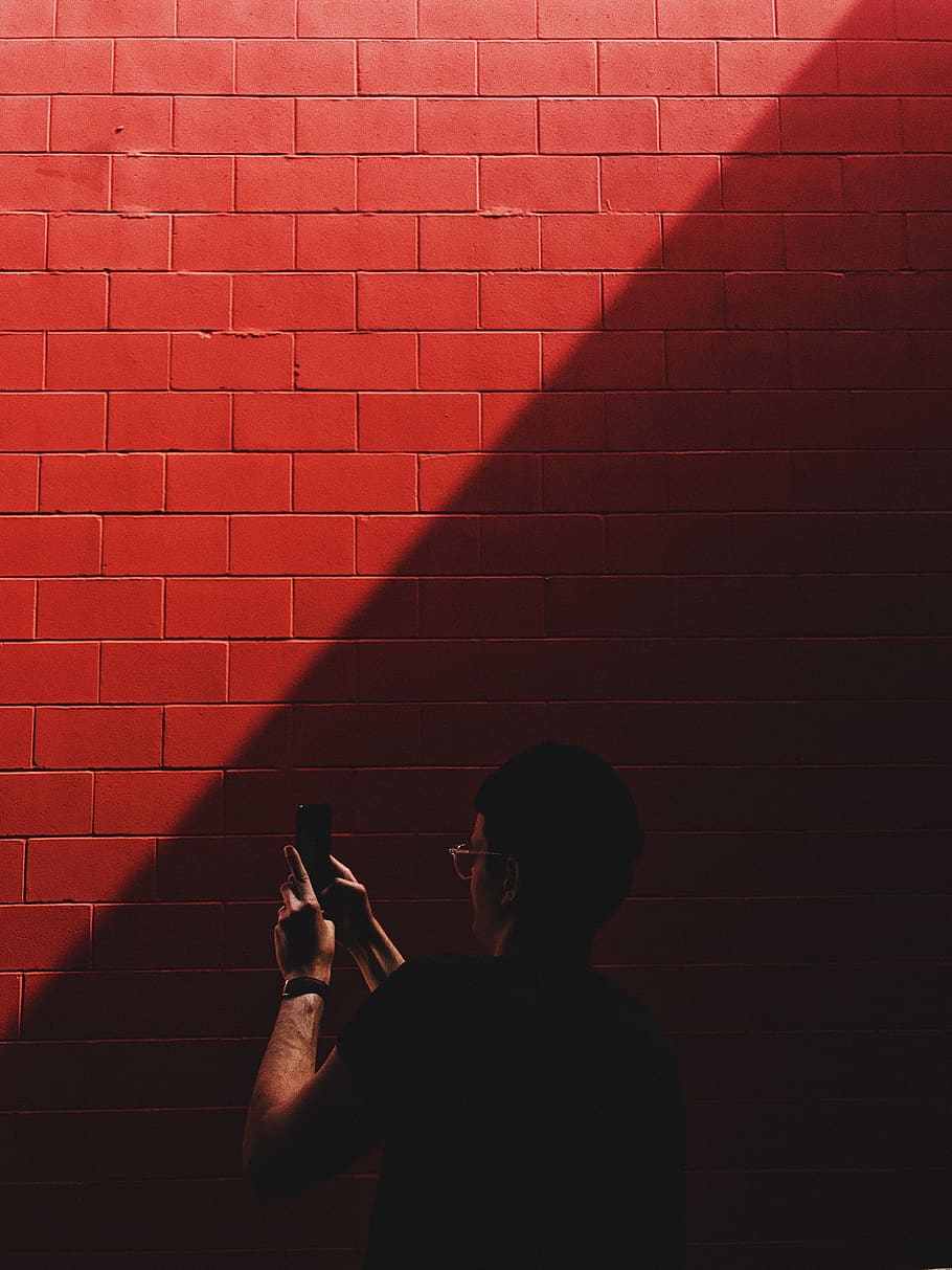 red, wall, sunlight, dark, people, man, guy, mobile, phone HD wallpaper