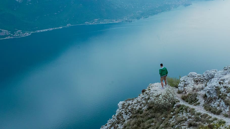 Photo of Man Standing on Cliff , adventure, beach, idyllic, landscape HD wallpaper