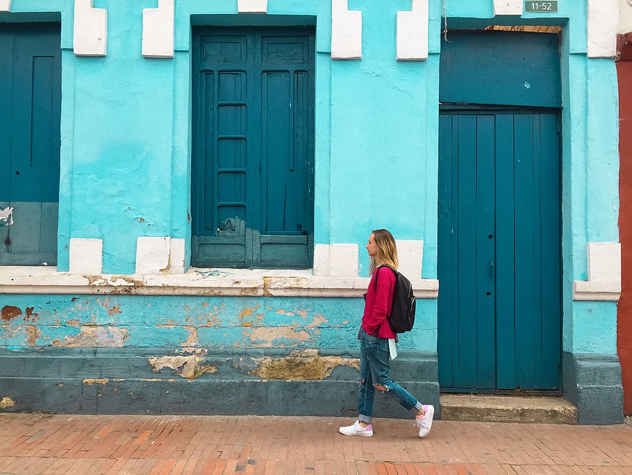 Woman Walking Street With Blue Building, architecture, backpack HD wallpaper