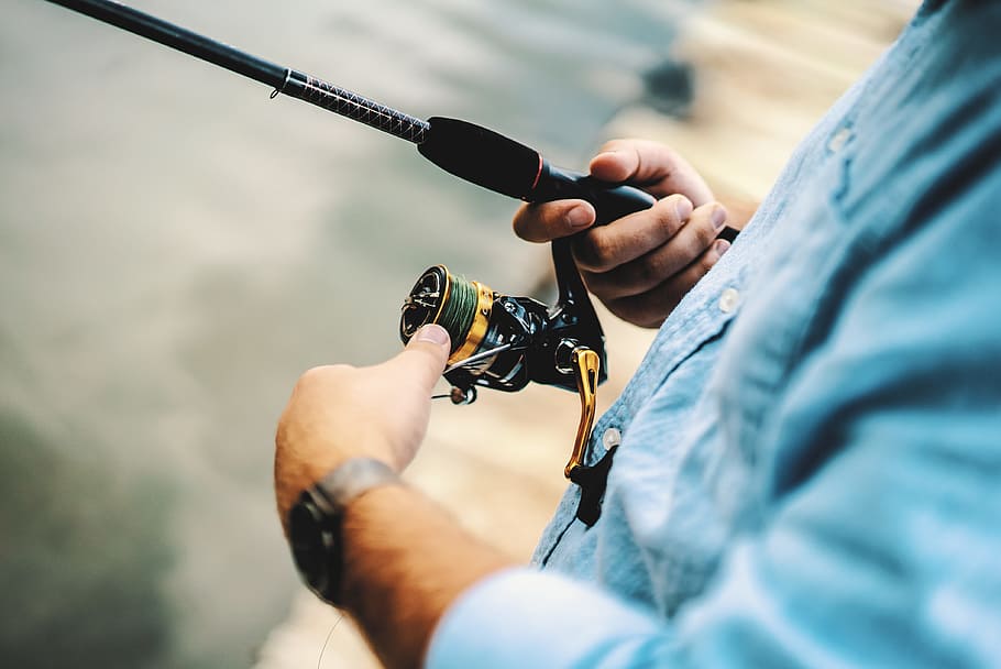 HD wallpaper: person holding black and yellow fishing reel, hand, rod, fisherman - Wallpaper Flare