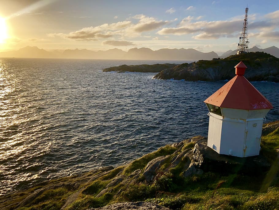 lighthouse, sunset, sunshine, ocean, sky, clouds, travel, hike HD wallpaper