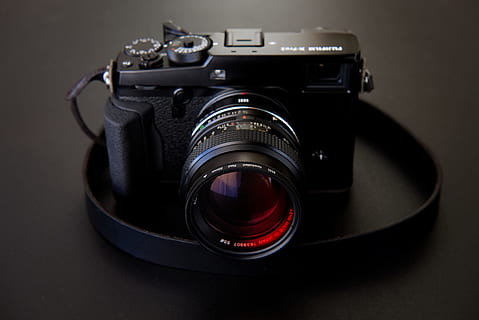 black DSLR camera on black surface, lens, tech, gear, fuji, film HD wallpaper