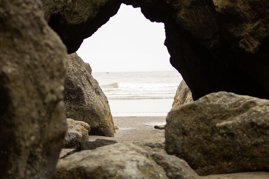 ocean outside cave during daytime, rock, water, formation, beach HD wallpaper