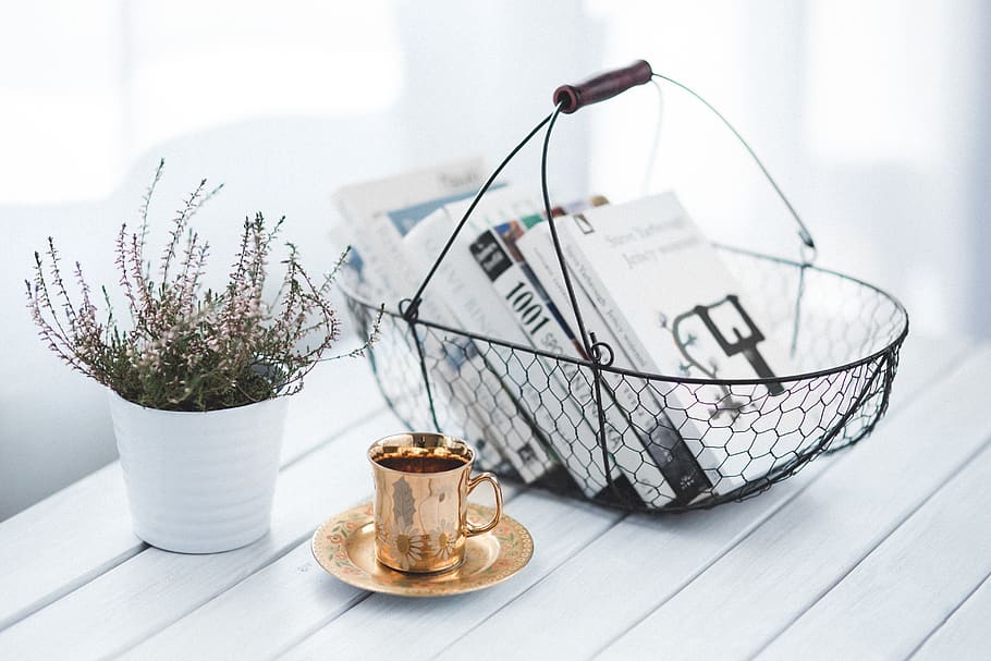 Golden cup and basket with books, coffee, container, decor, family
