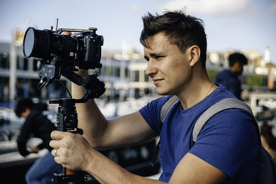 man setting up his camera, one person, technology, young adult HD wallpaper