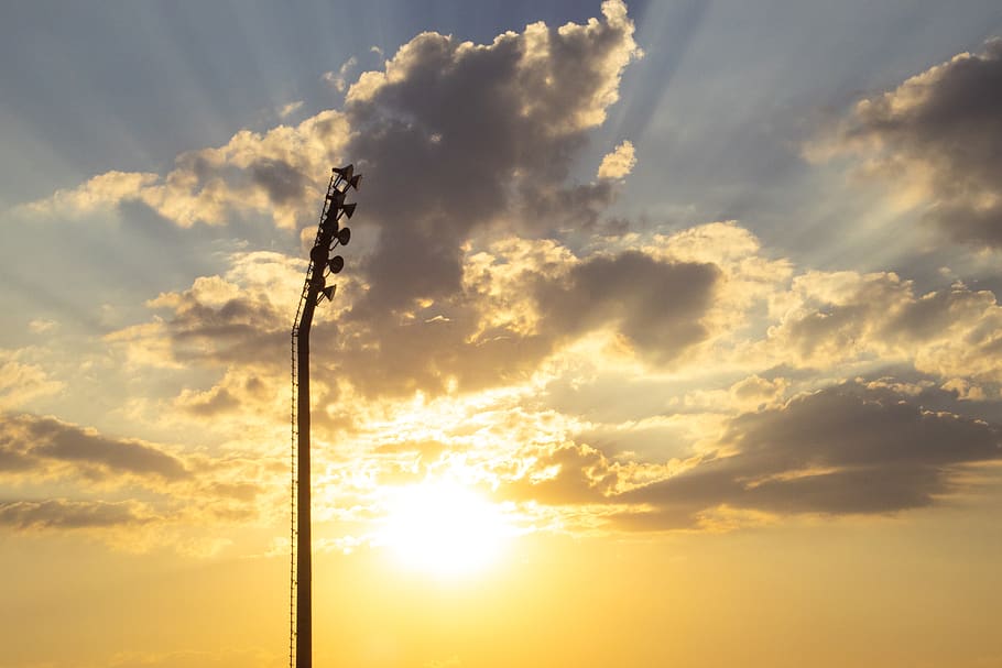 Silhouette Photo of Light Tower Under Sunrays, backlit, clouds HD wallpaper