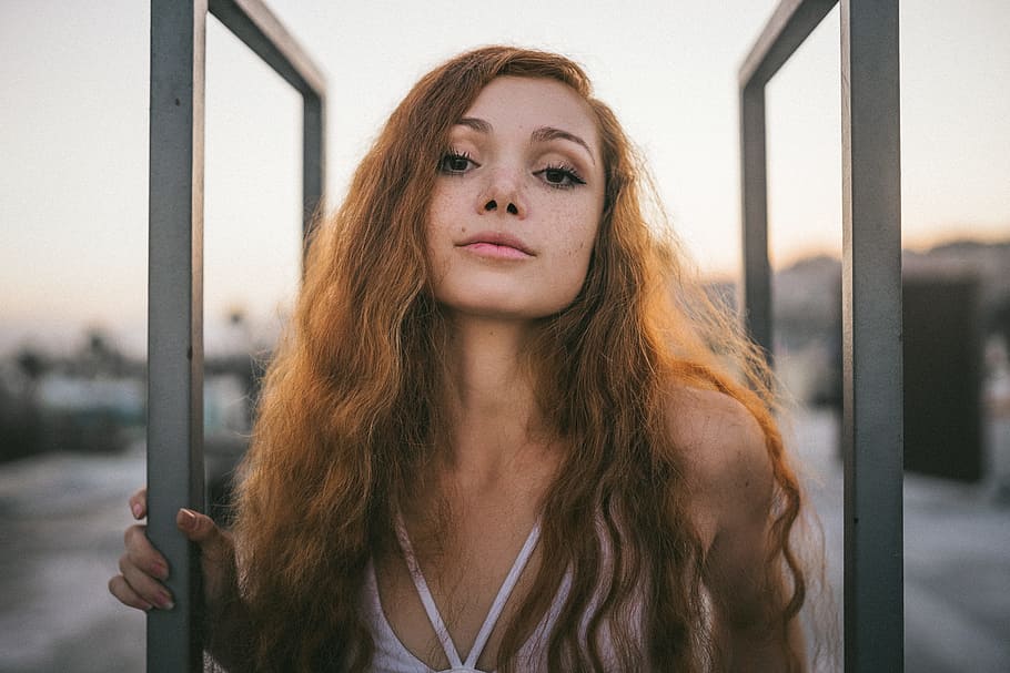woman wearing white top taking selfie, portrait, person, redhead