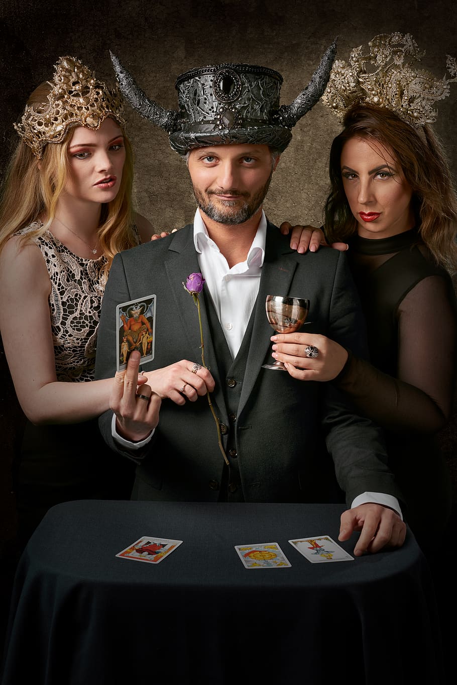 man holding tarot card, human, person, glass, clothing, apparel