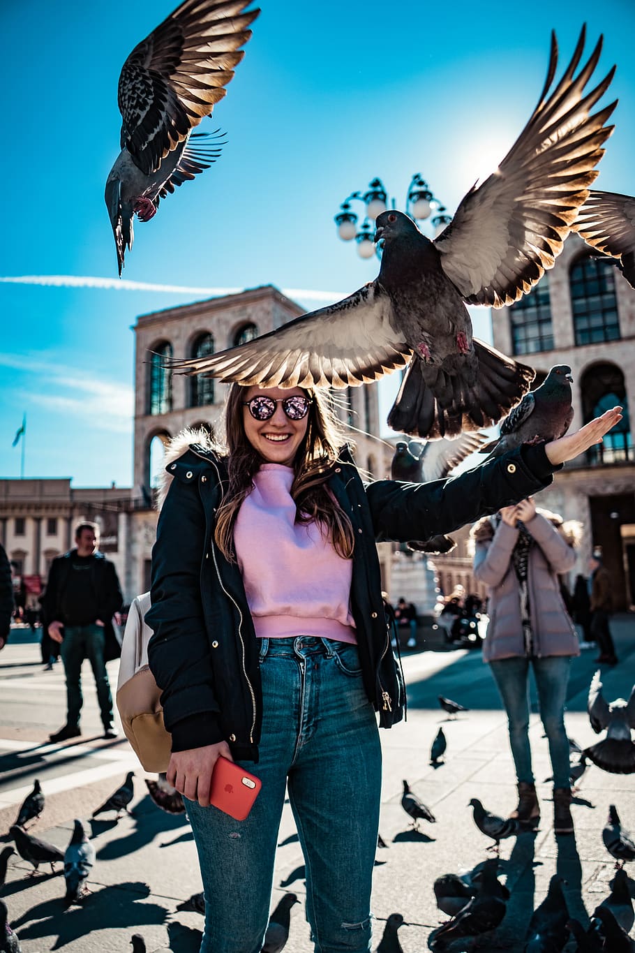 Woman Smiles and Stands Near Flying Pigeons, action, beautiful, HD wallpaper
