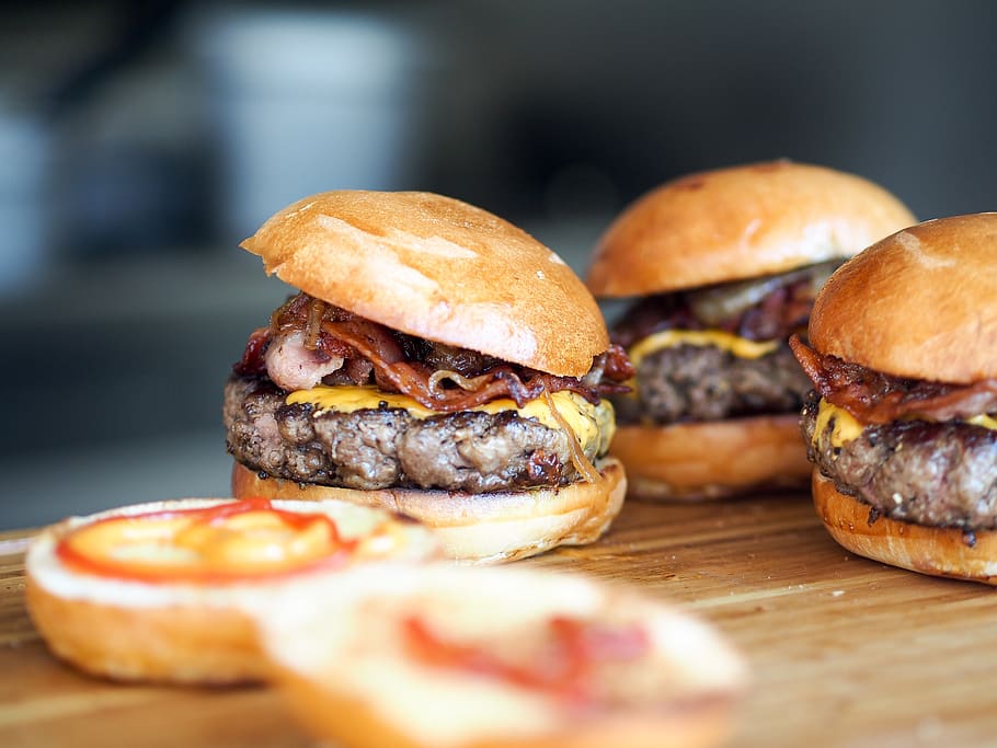 hamburgers, buns, beef, bacon, cheese, ketchup, mustard, condiments HD wallpaper