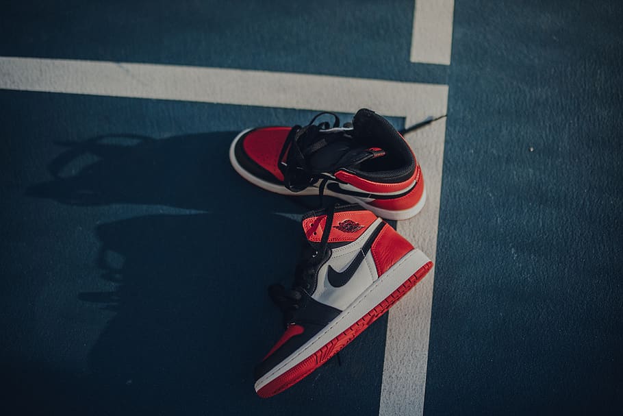 pair of white-black-and-red Air Jordan 1's, road, sign, high angle view Wallpaper