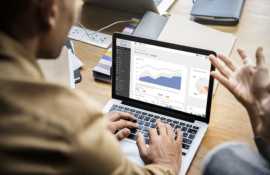 Man Using Laptop Computer on Table, chart, colleagues, communication HD wallpaper