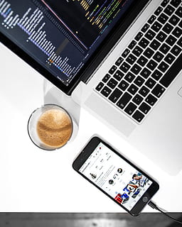 MacBook Pro near space gray iPhone 6 on white wooden table, notebook HD wallpaper