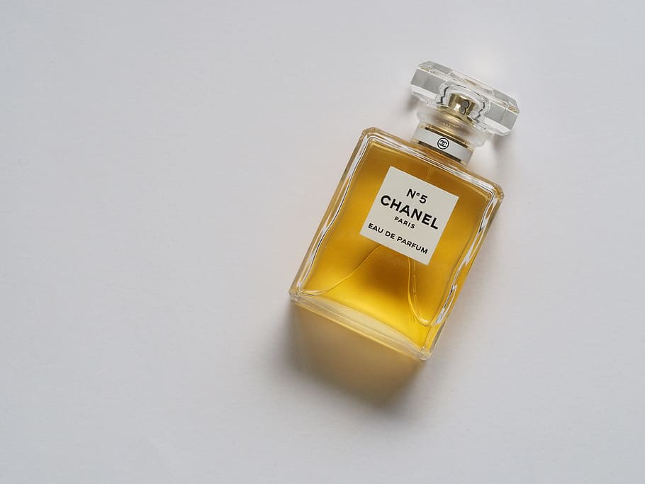 Chanel N5 fragrance bottle, perfume, chanel no.5, yellow, flatlay