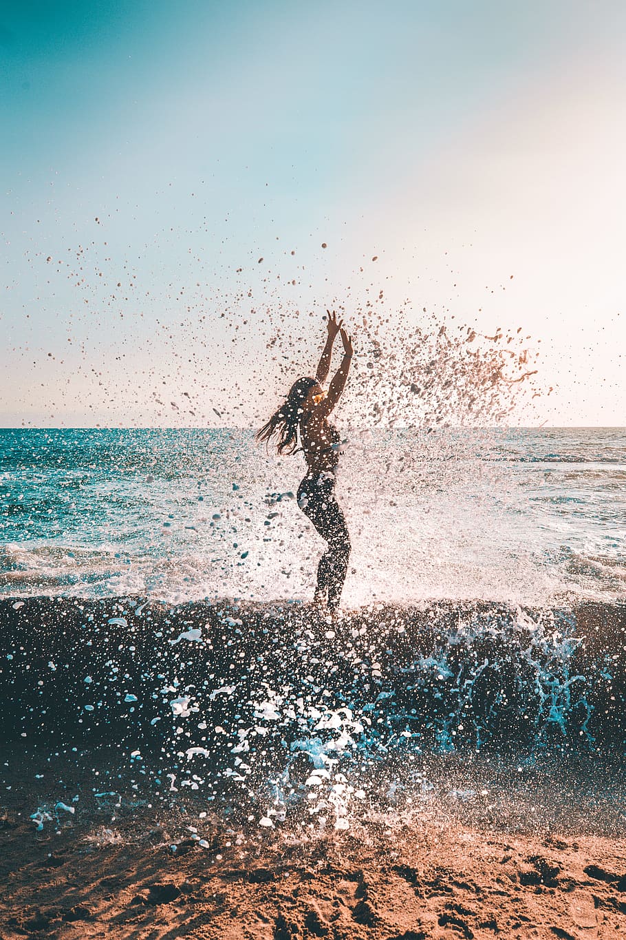 woman jumping on seashore during daytime, ocean, adventure, sunset HD wallpaper