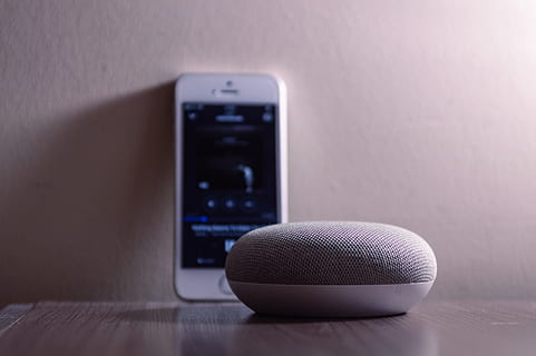 Gray Google Home Mini Beside Silver Iphone 5s, cellphone, cellular telephone HD wallpaper