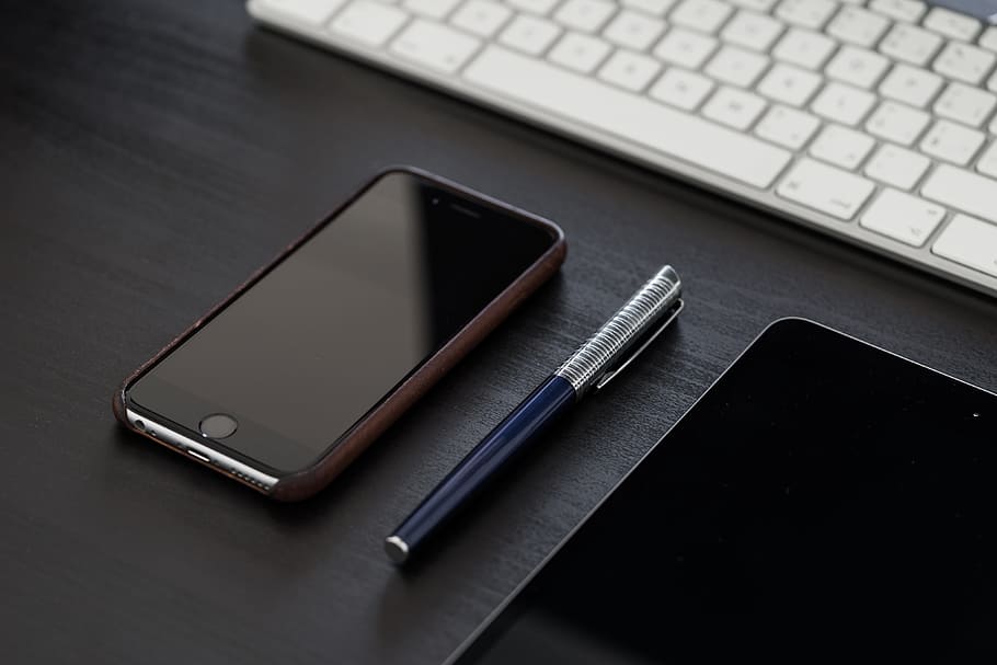 Black iPhone on Black Office Desk, business, clean, elegant, gear