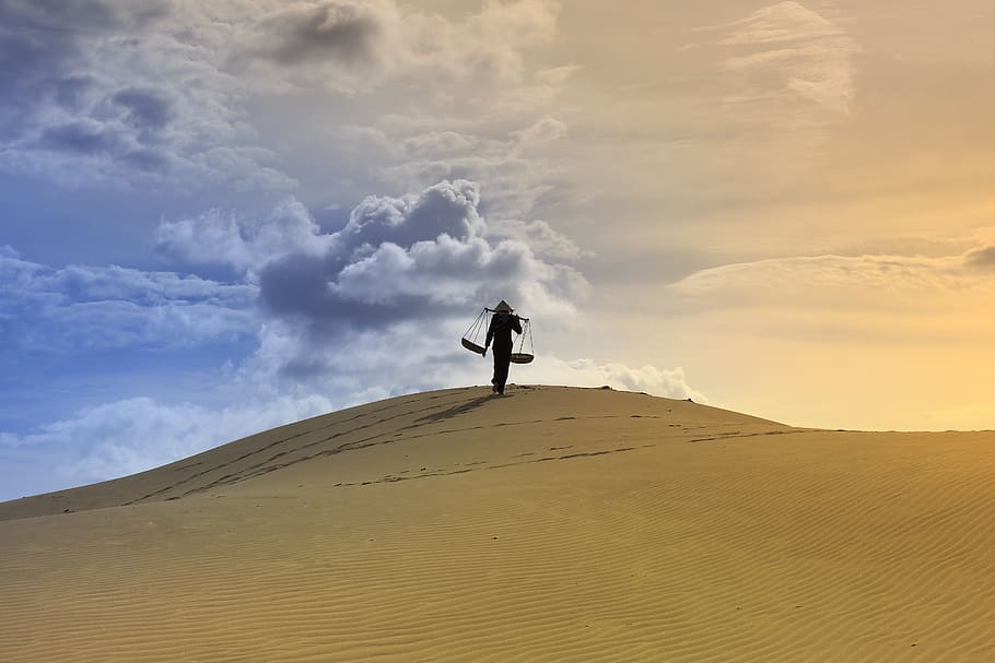 Photo Of Man Standing In The Dessert, adult, blue skies, clouds HD wallpaper