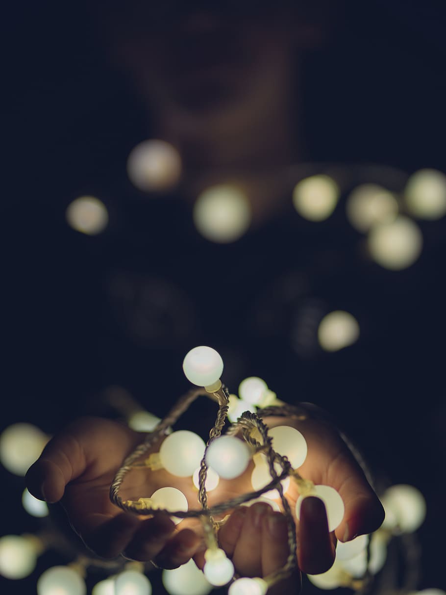 white string lights, sphere, flare, finger, hand, hands, shine HD wallpaper