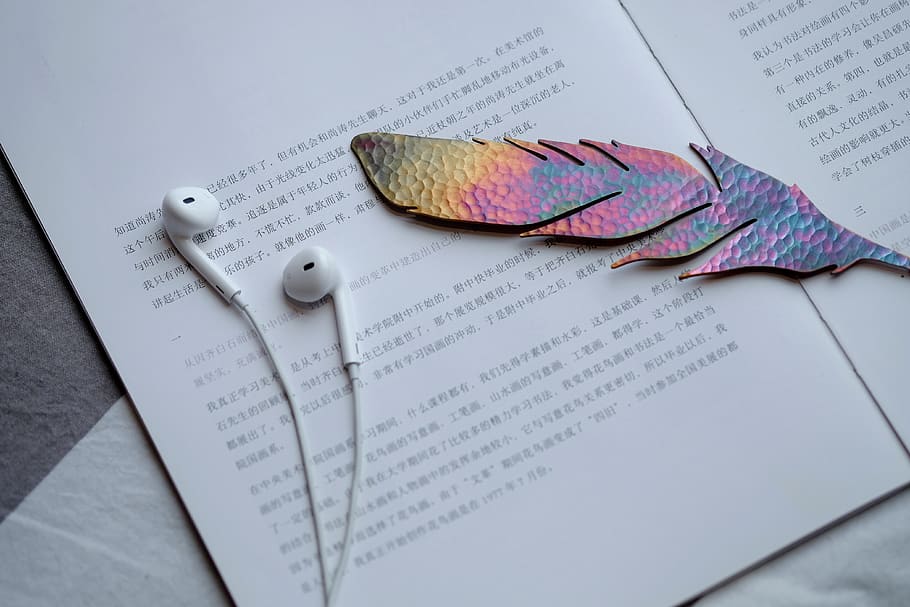 white earbuds on paper, guangzhou, china, bronze, headphone, diary HD wallpaper