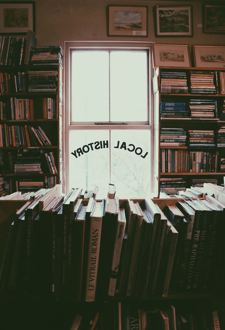 assorted-title book lot on rack inside room, publication, education HD wallpaper