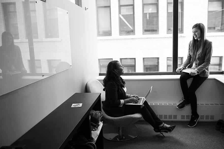 Grayscale Photo of Woman Talking to Her Colleague, black and white HD wallpaper