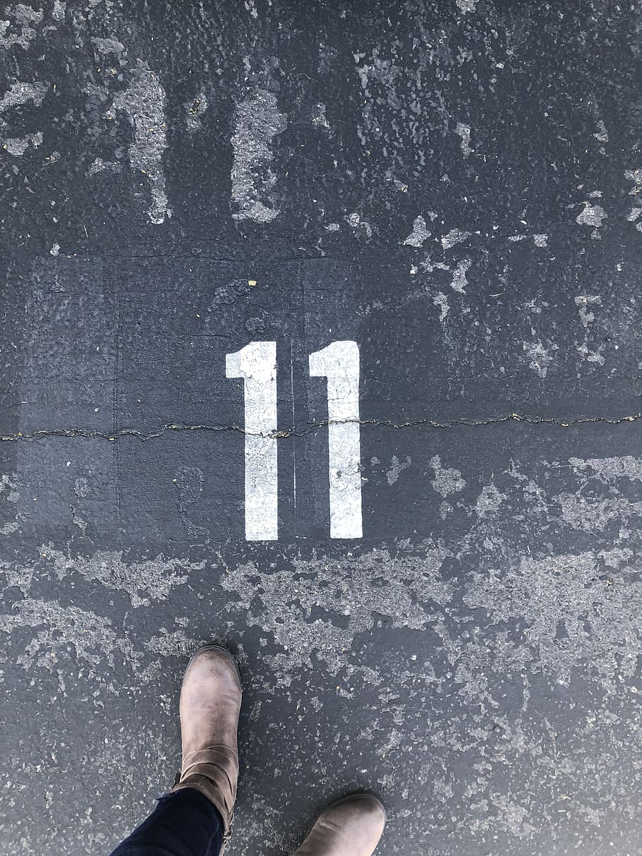 HD wallpaper: Person Standing On Concrete Floor With Number 11 Paint, boots  | Wallpaper Flare