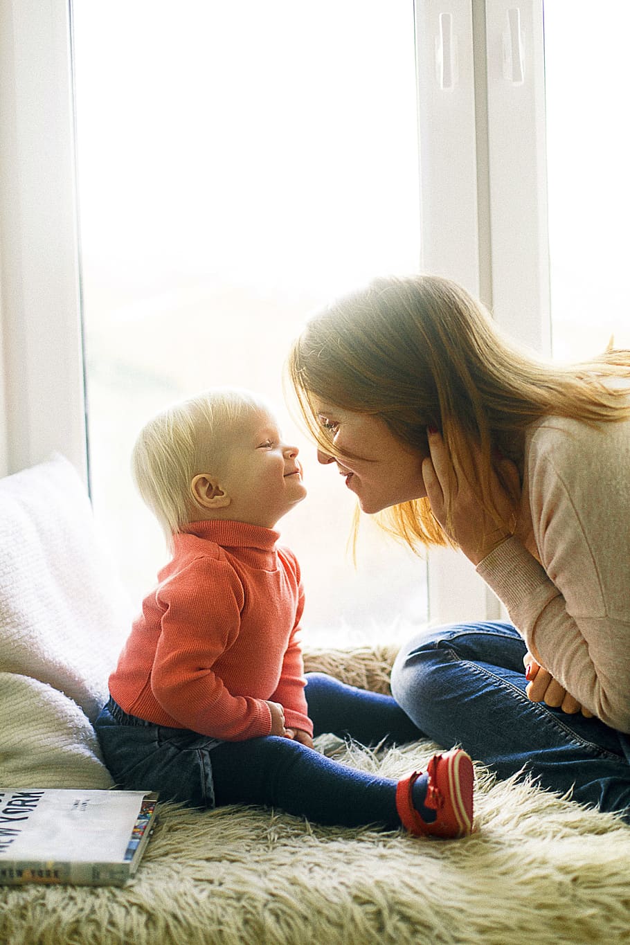 Woman And Child Sitting On Fur Covered Bed, affection, cute, enjoyment HD wallpaper