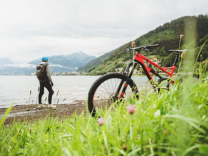 Man Standing Near Shore, active, adventure, bicycle, biker, biking HD wallpaper
