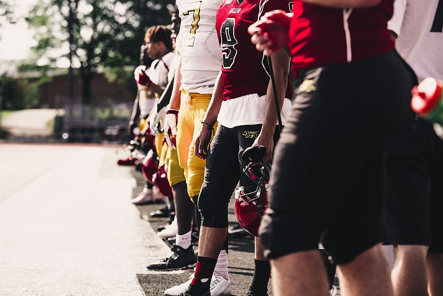 two yellow-and-red football jerseys, helmet, anonymous, team, HD wallpaper