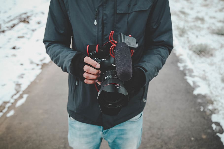 Man Holding Dslr Camera, cameraman, canon, cold, daytime, ice HD wallpaper