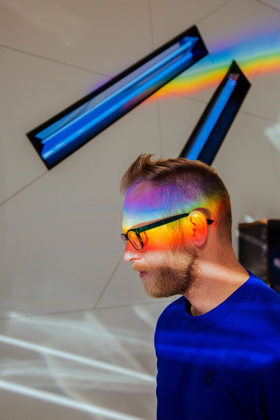man with multiple colors reflected on his face, one person, glasses HD wallpaper