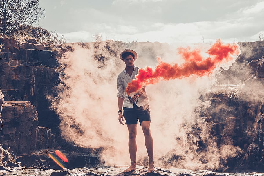Photo of Man Holding Orange Smoke, daylight, environment, flair HD wallpaper