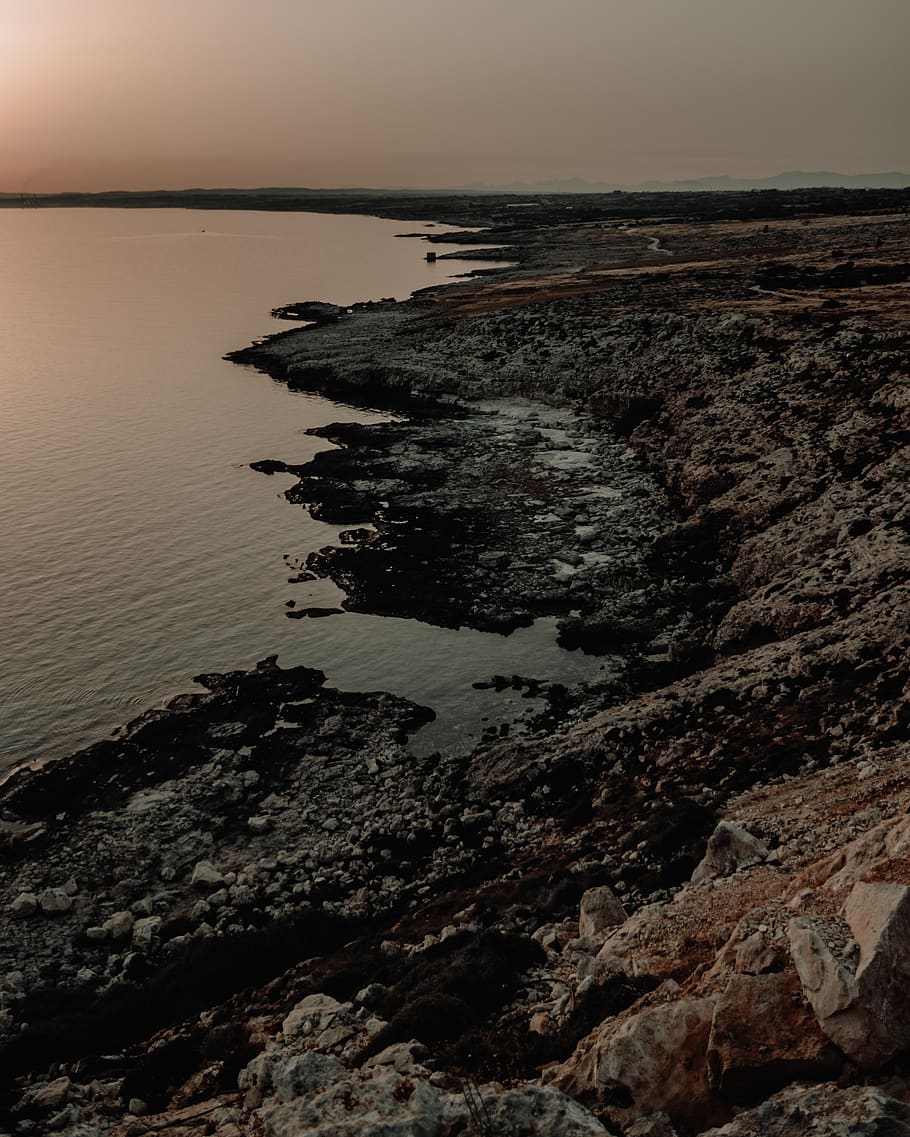 gray stone island, nature, outdoors, promontory, sunset, sea HD wallpaper