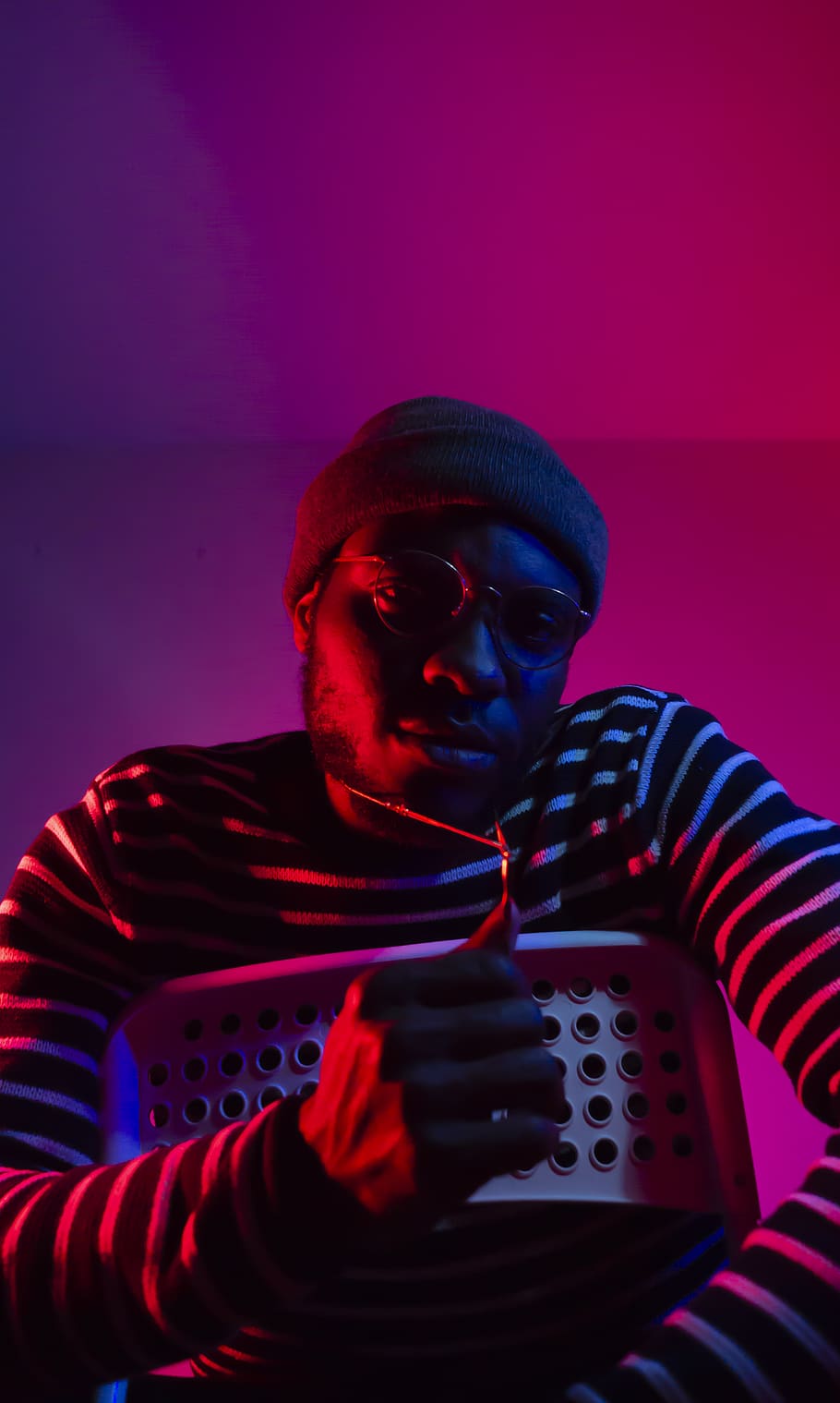 man inside pink lighted room, one person, indoors, portrait, front view HD wallpaper