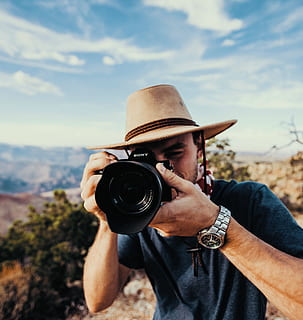 man holding DSLR camera, person, human, electronics, photographer HD wallpaper