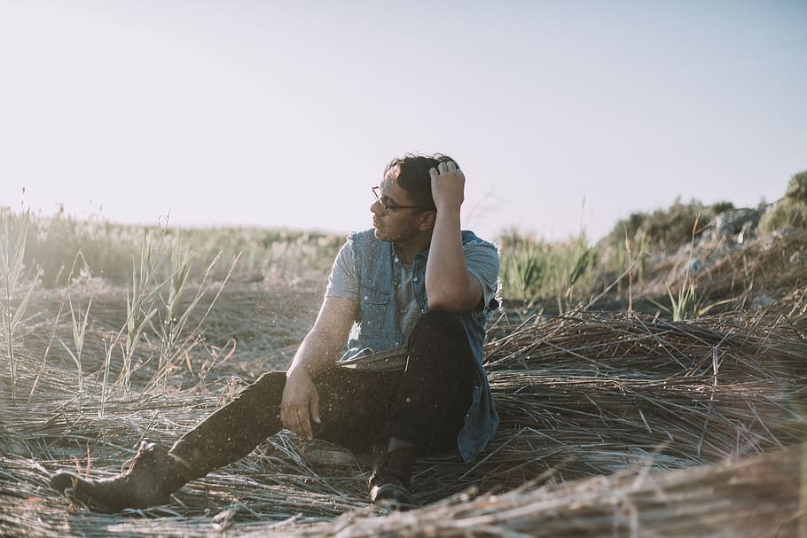 man sitting on brown grass at daytime, person, people, human HD wallpaper