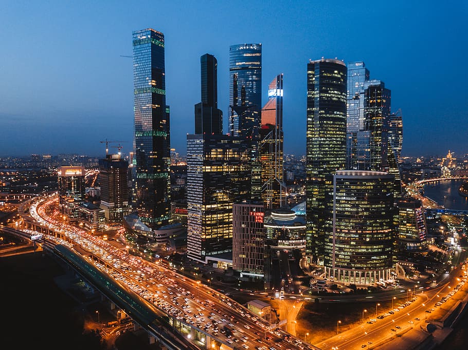 high-rise building with lights, road, landscape, drone view, architecture HD wallpaper