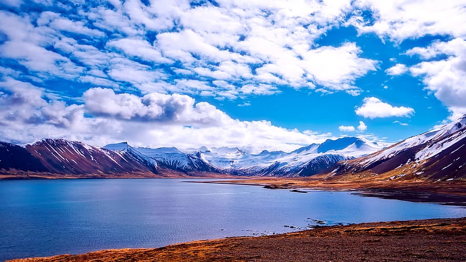 White and Brown Mountains and White Cirrus Clouds, daylight, lake HD wallpaper