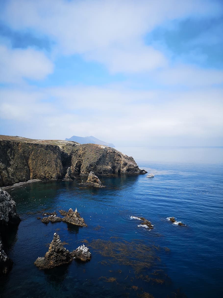 Aerial Photo Of Blue Sea Water And Rock Formation, cliff, daylight HD wallpaper