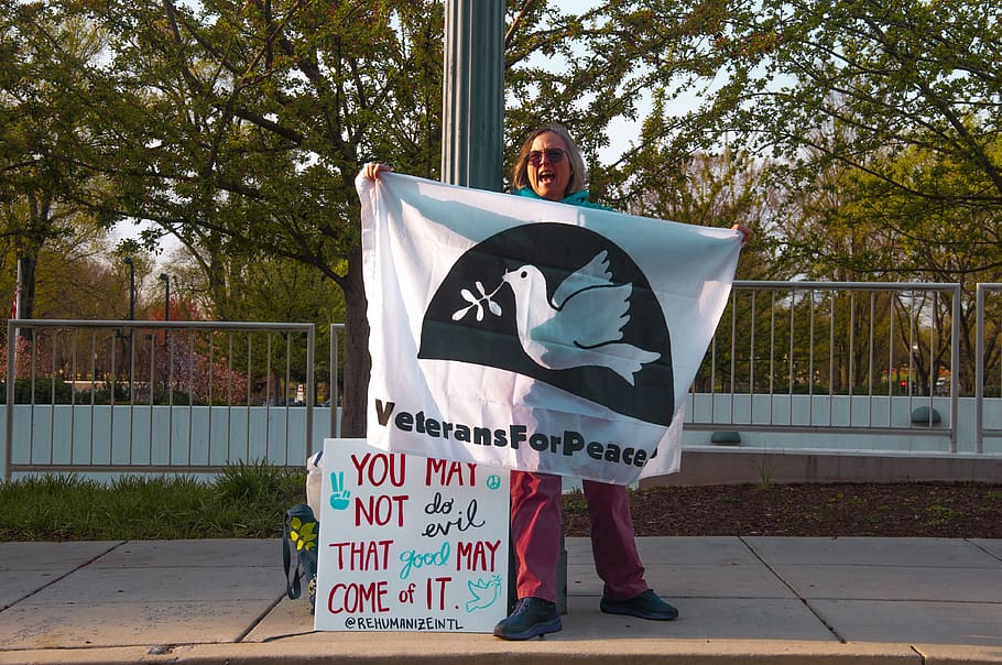 woman showing veterans for peace banner, text, person, human, HD wallpaper