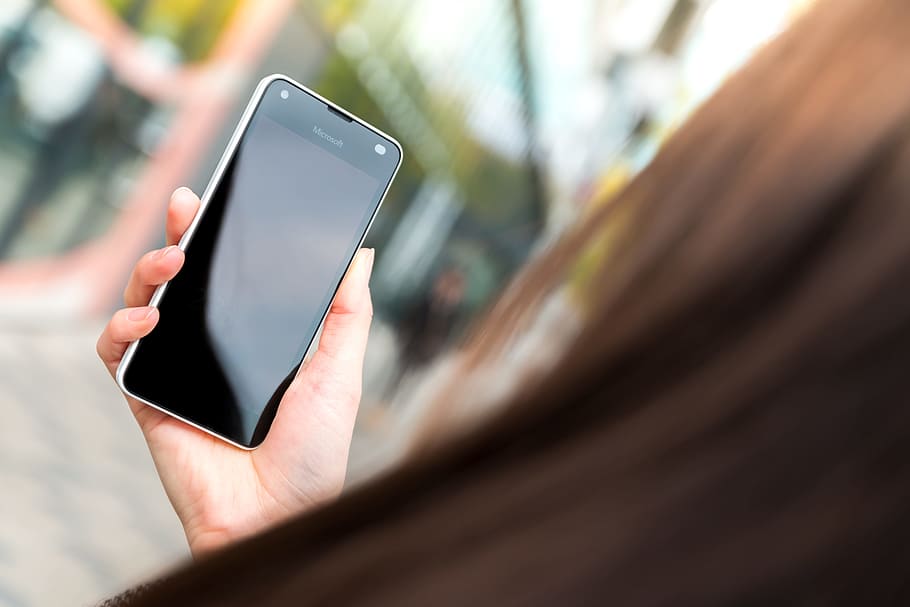 Woman uses her modern smartphone on the street., technology, communication HD wallpaper