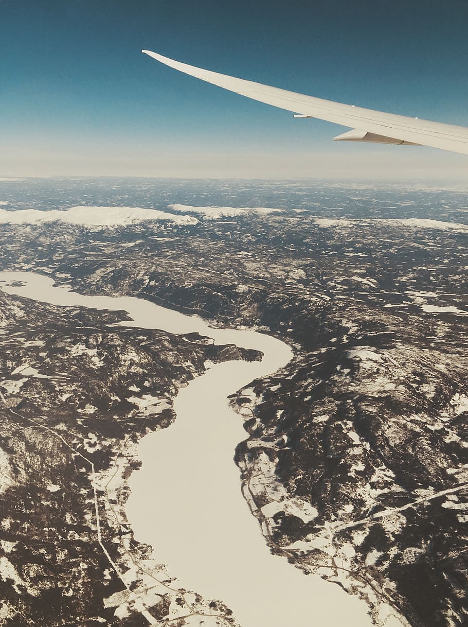 norway, airplane window, nature, trees, clouds, river, snow