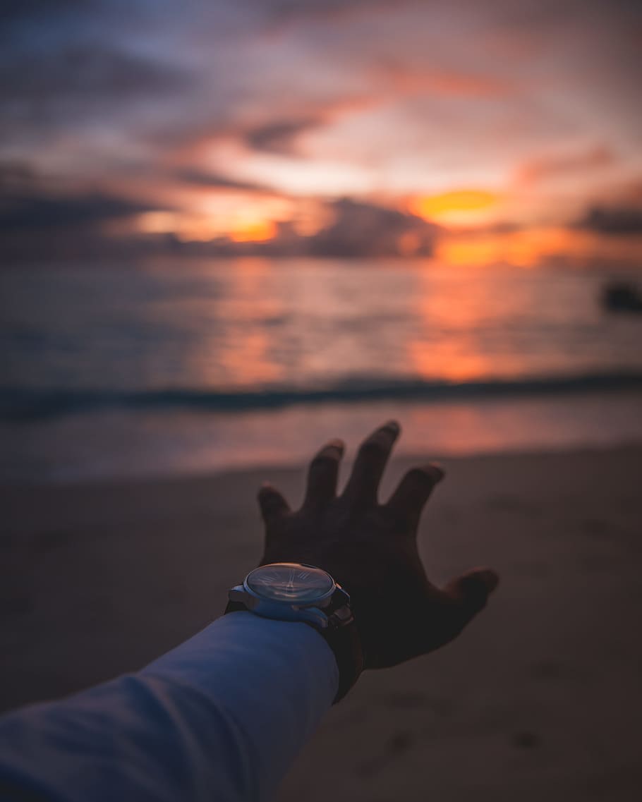 person raising hand, beach, sky, sunset, sunrise, watch, reach HD wallpaper