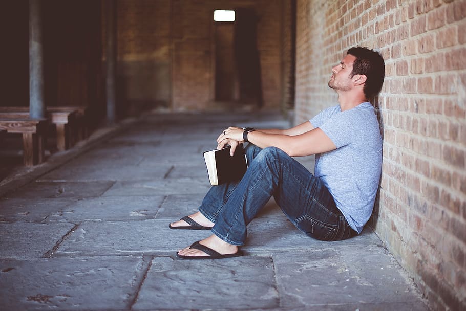 people, man, alone, sitting, wall, book, bible, one person HD wallpaper