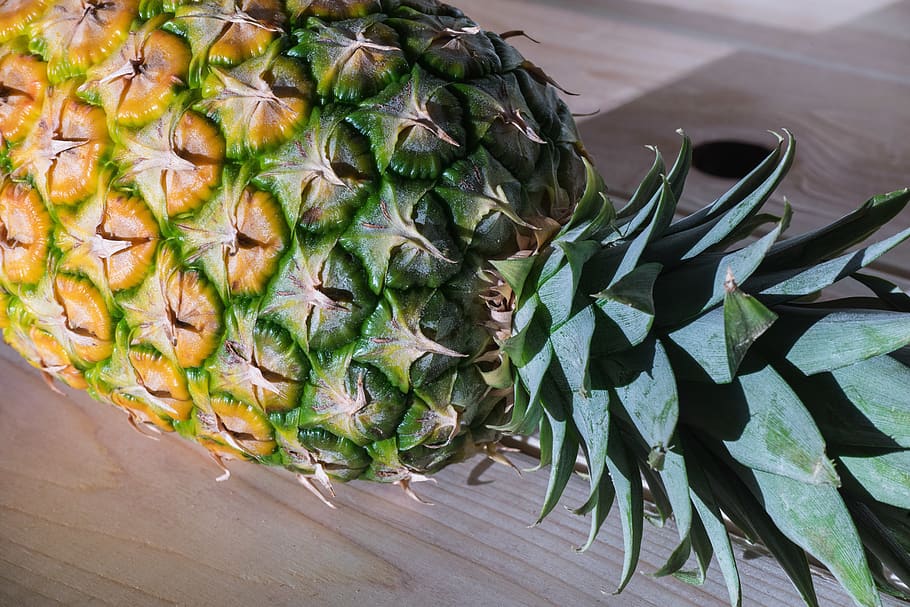 Pineapple on Brown Surface, close-up, color, confection, exotic