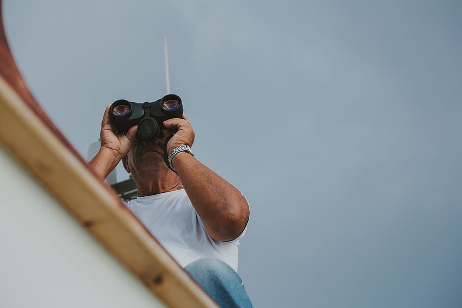 man holding black binoculars, old man, cloudy sky, boat, sea HD wallpaper