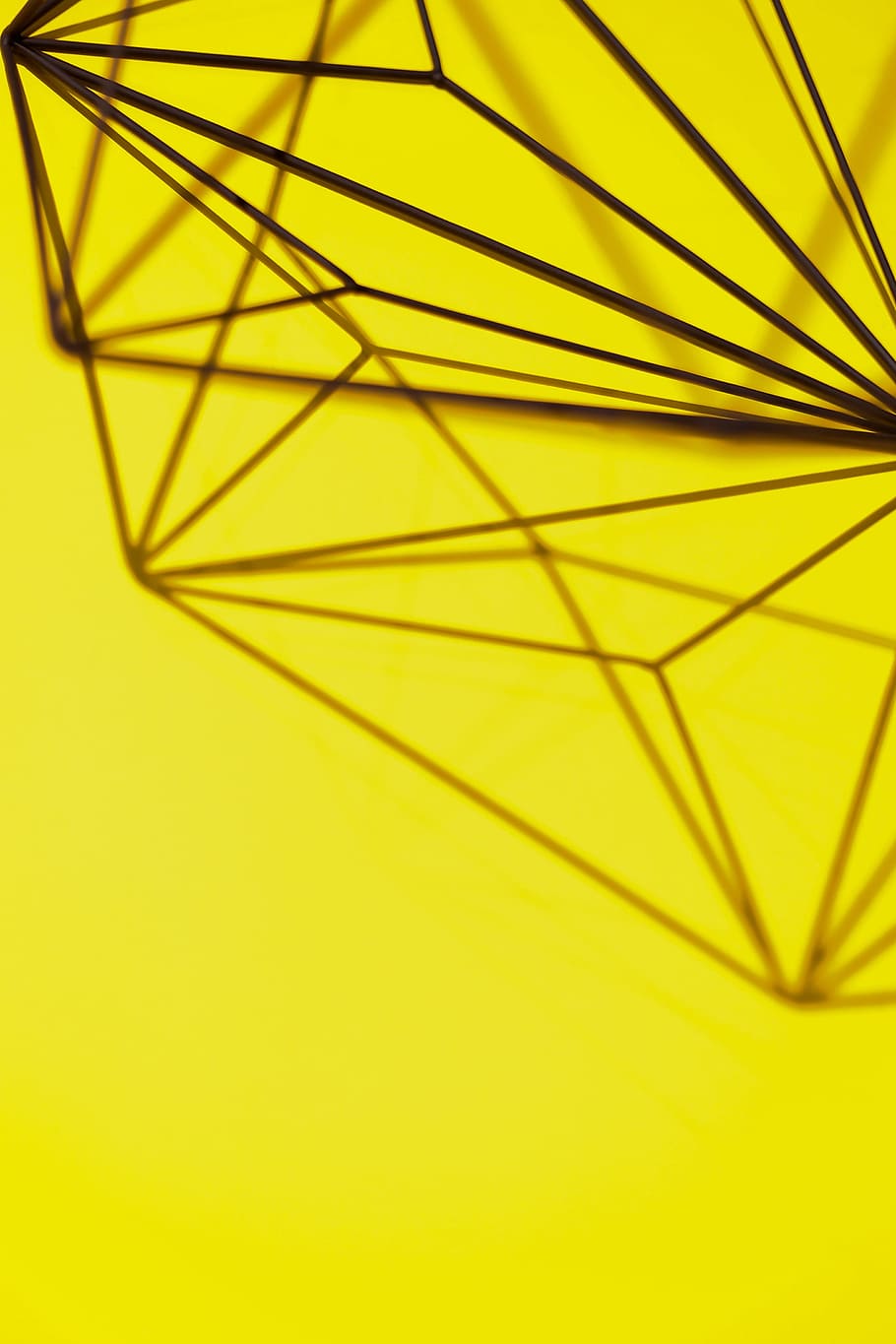 Geometric decoration on yellow background, texture, studio shot HD wallpaper