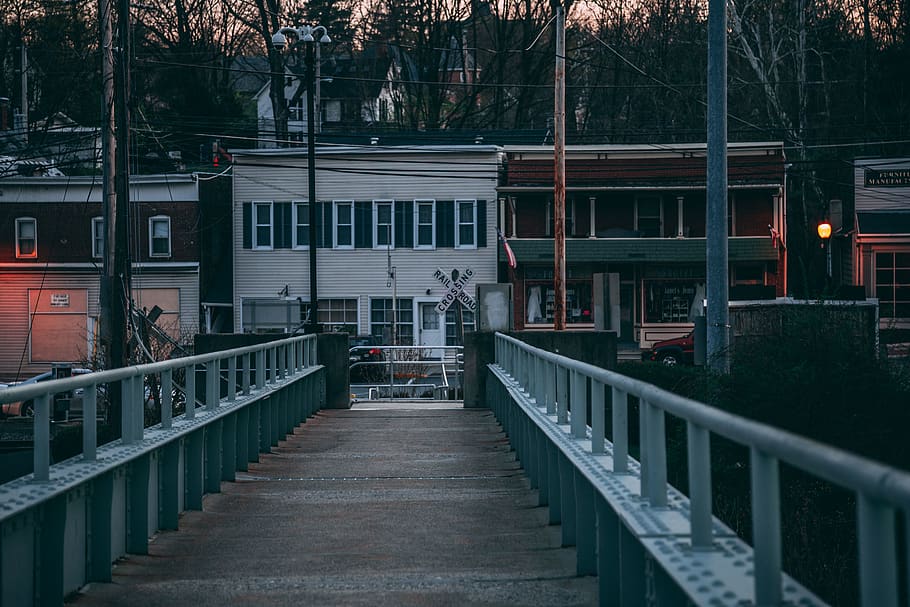Brown Wooden Bridge Across Body of Water, buildings, sunset, town HD wallpaper
